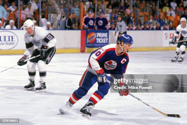 Dale Hawerchuk of the Winnipeg Jets skates against the Los Angeles Kings during their game at the Great Western Forum circa 1988 in Inglewood,...