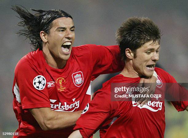 Liverpool's Czech striker Milan Baros celebrates after Spanish midfielder Xabi Alonso scored to tie the score at 3-3 against AC Milan during their...