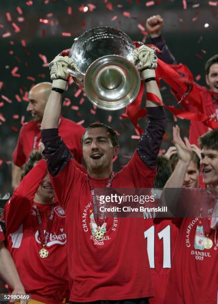Liverpool goalkeeper Jerzy Dudek of Poland lifts the European Cup after Liverpool won the European Champions League final against AC Milan on May 25,...