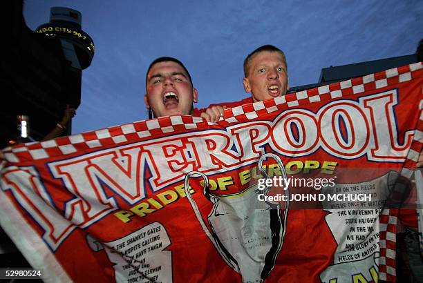 Liverpool fans celebrate outside a pub in their hometown during the Champions League Final between Liverpool FC and AC Milan after Liverpool...