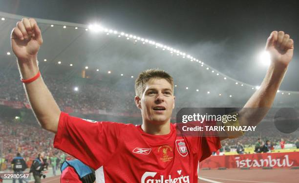 Liverpool's England's captain and midfielder Steven Gerrard greets supporters during the honour lap at the end of the UEFA Champions league football...