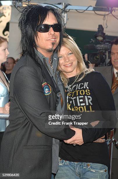 Nikki Sixx of the band "Motley Crue" and Donna D'Errico arrive at the charity premiere of "Star Wars: Episode III - Revenge of the Sith," a benefit...