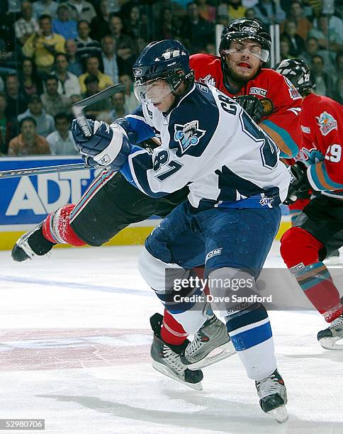 Sidney Crosby of the Rimouski Oceanic takes a hit from Shea Weber of the Kelowna Rockets during the Memorial Cup Tournament at the John Labatt Centre...