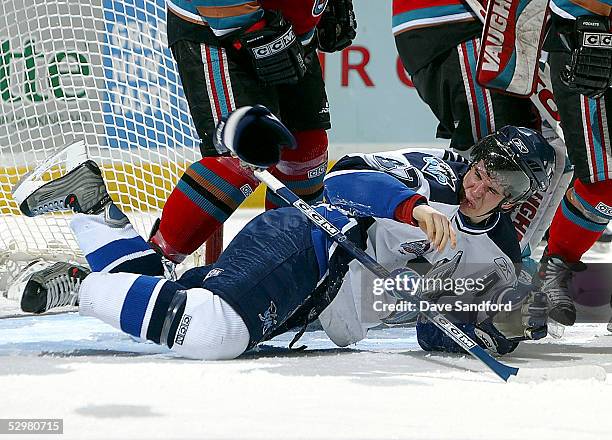 Sidney Crosby of the Rimouski Oceanic throws his glove off in anger after being crosschecked by Tyler Mosienko of the Kelowna Rockets during the...