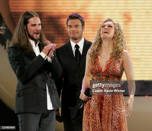 Singer Carrie Underwood is named the new American Idol by host Ryan Seacrest as American Idol finalist Bo Bice looks on during the American Idol...