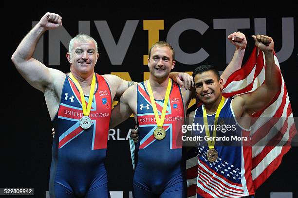 Competitors celebrate during the medals ceremony at the Invictus Games Orlando 2016 Rowing Finals at the ESPN Wide World of Sports complex on May 9,...