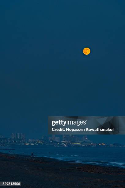 full moon over chigasaki beach - chigasaki beach stock pictures, royalty-free photos & images