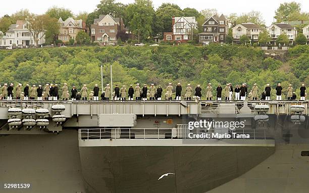 The USS John F. Kennedy sails in the Hudson River with New Jersey in the background during Fleet Week May 25, 2005 in New York City. Fleet Week...