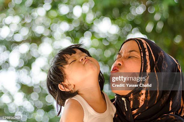 mother and daughter - malay archipelago stock pictures, royalty-free photos & images