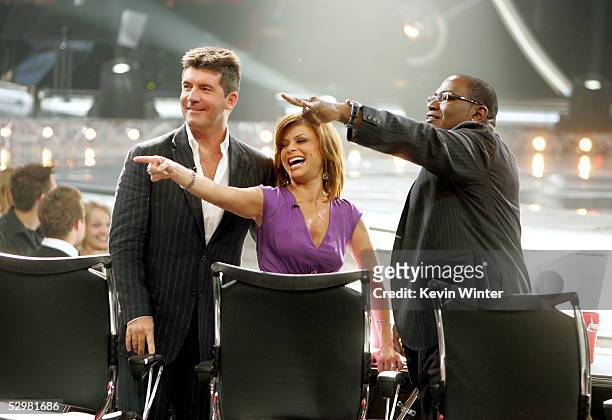 American Idol judges Simon Cowell, Paula Abdul and Randy Jackson are seated infront of the stage at the American Idol Finale: Results Show held at...