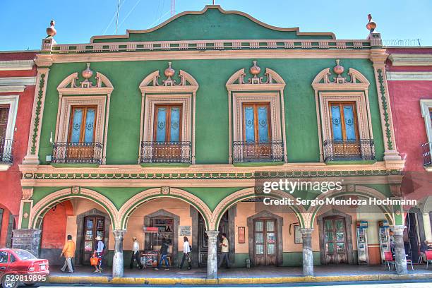 a green building in tlaxcala, mexico - tlaxcala stock pictures, royalty-free photos & images