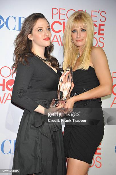Actors Kat Dennings and Beth Behrs pose with Favorite New TV Comedy for "2 Broke Girls" in the press room at the People's Choice Awards 2012 held at...