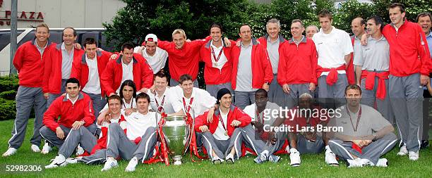 The players of Liverpool pose with the European Champions League Trophy one day after winning the European Champions League final against AC Milan on...