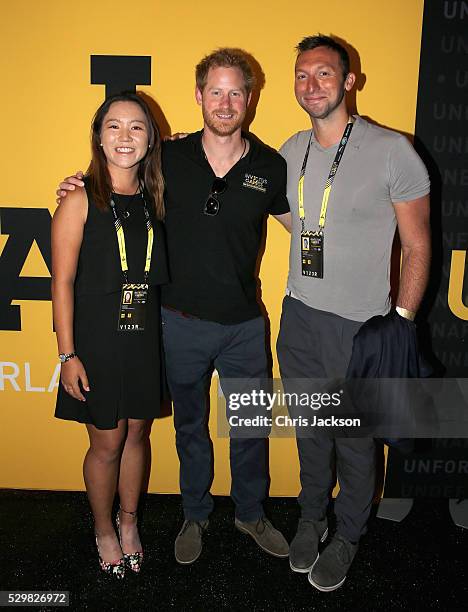 Prince Harry poses with Ian Thorpe and golfer Lydia Ko during a reception for the Invictus Games Foundation at the Invictus Games Orlando 2016 at...