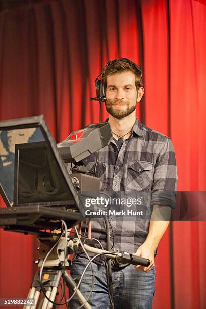 tv producer at teleprompter in a tv studio - teleprompter stock pictures, royalty-free photos & images