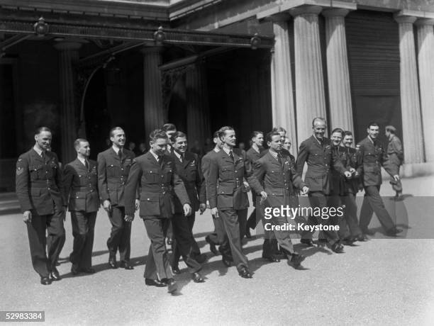Wing Commander Guy Gibson with the other members of his squadron who took part in the Dambusters raid during World War II. They are attending an...