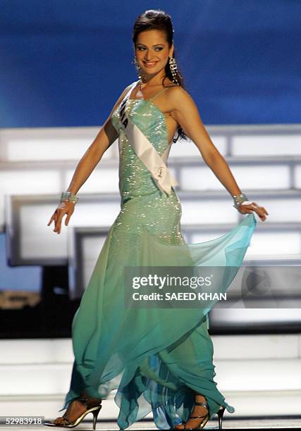 Miss Universe 2005 contestant Amrita Thapar of India perform during first round of judging in the swimwear and evening gown competition in Bangkok,...