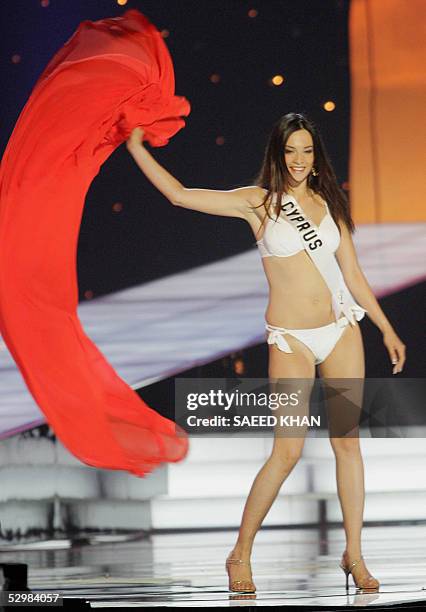 Miss Universe 2005 contestant Elena Hatjidemetriou of Cyprus performs during the first round of judging in the swimwear and evening gown competition...