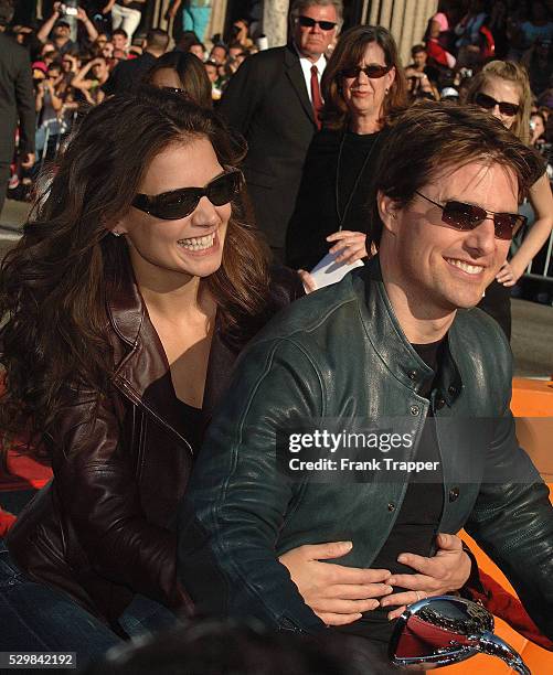 Tom Cruise and Katie Holmes arrive at the special fan premiere of "War of the Worlds," held at the Chinese Theater in Hollywood.