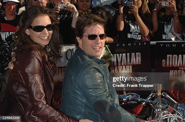 Tom Cruise and Katie Holmes arrive at the special fan premiere of "War of the Worlds," held at the Chinese Theater in Hollywood.