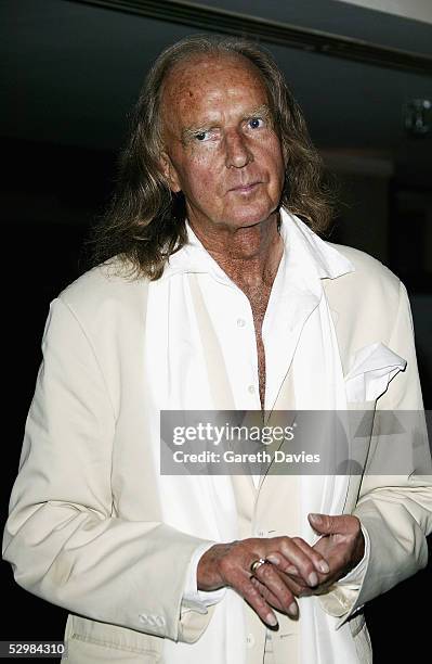 Sir John Tavener poses in the pressroom at the 50th Ivor Novello Awards at Grosvenor House on May 26, 2005 in London. The music awards honour...