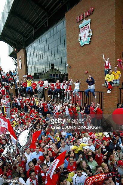 Thousands of fans wait at The Kop to welcome home the Liverpool team, 26 May following their Champions League victory over AC Milan in Istanbul the...
