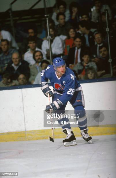 Czech hockey player Peter Stastny of the Quebec Nordiques waits for a pass during a game against the New York Islanders at Nassau Coliseum,...