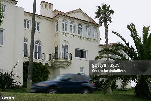 Car drives by a luxury home May 26, 2005 in the Sea Cliff neighborhood of San Francisco, California. According to a study released Wednesday by San...