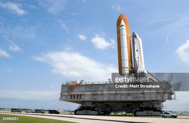 Space Shuttle Discovery rolls along the crawler-way to the Vehicle Assembly Building to be de-mated from its external tank and solid rocket boosters...