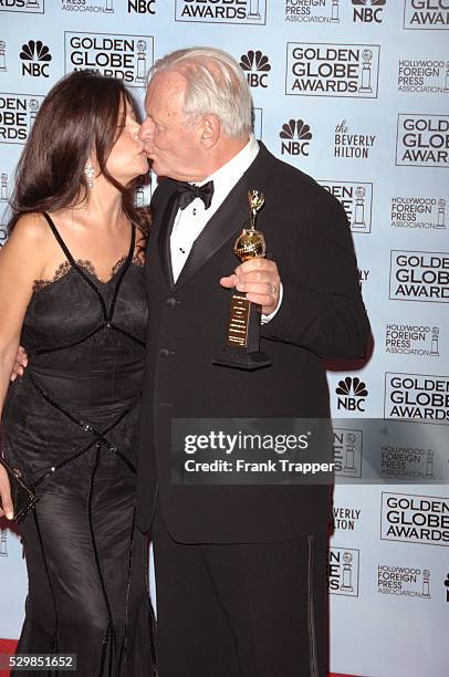 Actor Anthony Hopkins and wife Stella Arroyave in the press room with his award for Lifetime Achievement at the 63rd annual Golden Globe Awards held...