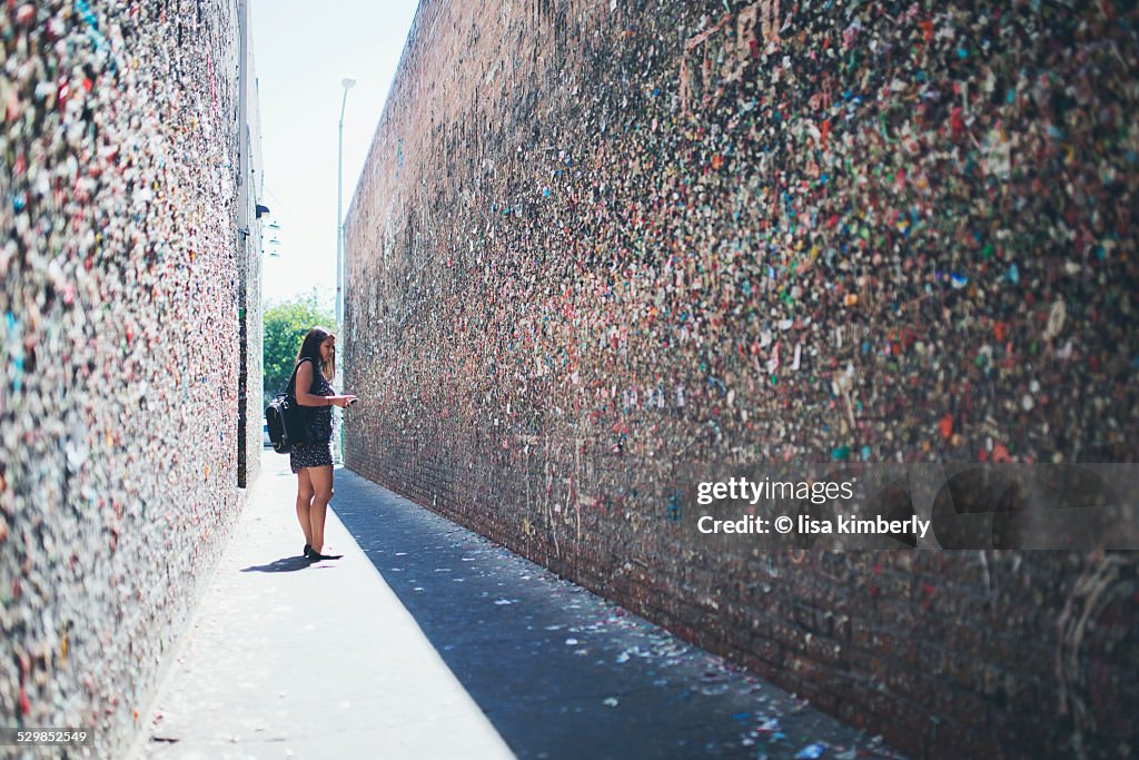 Young Woman Standing In Bubblegum Alley