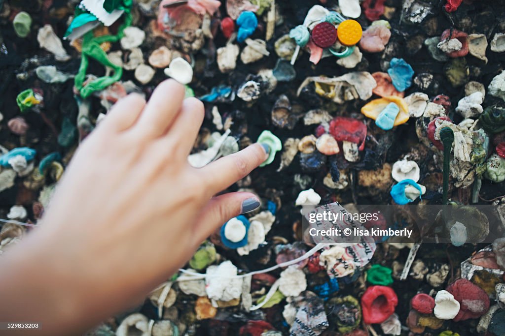 Woman's Hand Adding Gum To Bubblegum Alley