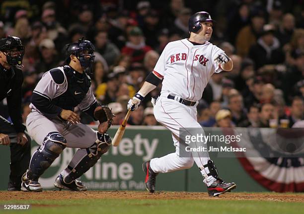 Outfielder Trot Nixon of the Boston Red Sox swings at a New York Yankees pitch during the MLB game at Fenway Park on April 13, 2005 in Boston,...