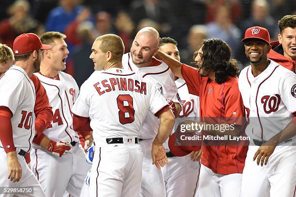 Clint Robinson of the Washington Nationals celebrates with team mates a walk off home run during a baseball game against the Detroit Tigers at...