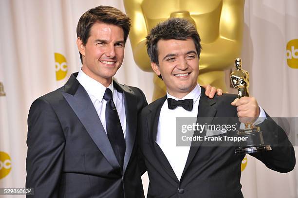 Actor, presenter Tom Cruise and producer for The Artist Thomas Langmann, pose at the 84th Annual Academy Awards held at the Hollywood & Highland...