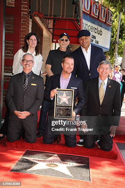 Actor Chris O'Donnell and hosts pose at the ceremony that honored him with a Star on the Hollywood Walk of Fame.