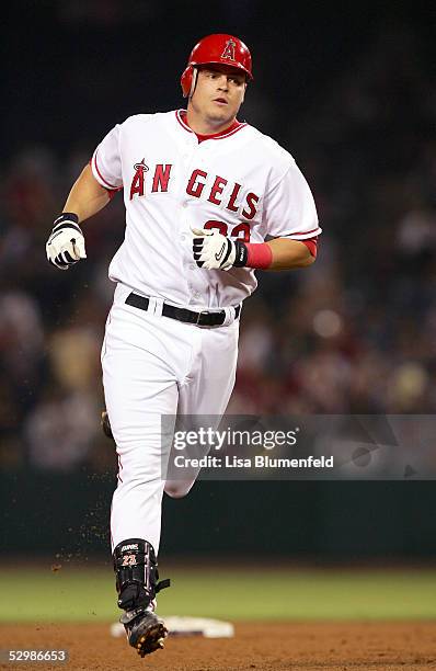 Dallas McPherson of the Los Angeles Angels of Anaheim rounds the bases after hitting a two-run home run in the seventh inning against the Chicago...