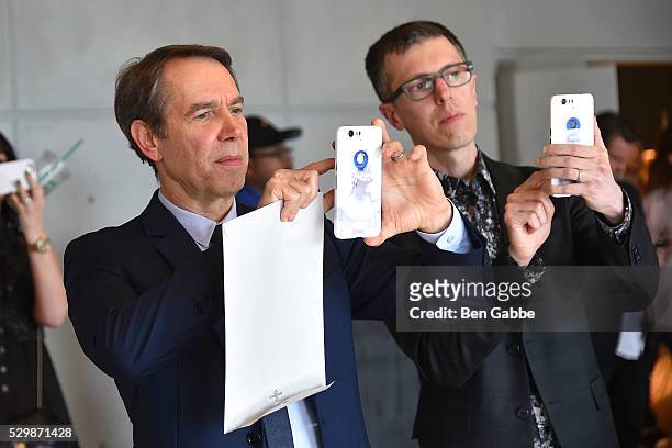Artist Jeff Koons takes a photo on a Google phone showcasing his design on the case at the Jeff Koons x Google launch on May 09, 2016 in New York,...