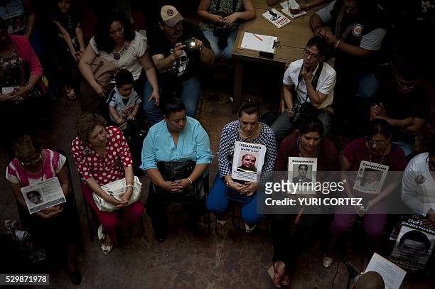 Women who have lost their children attend the opening of the "Huellas de La Memoria" exhibition at the "Casa de la Memoria Indomita" museum in Mexico...