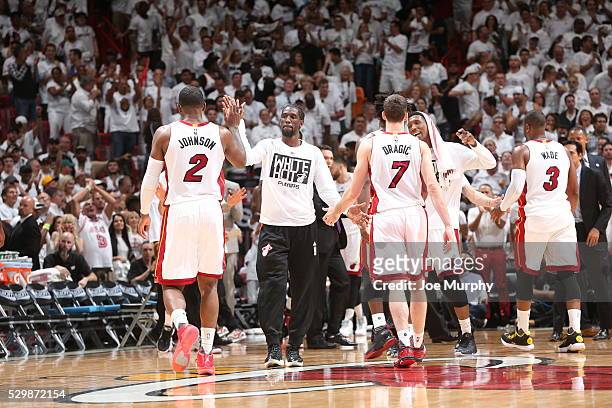 Joe Johnson of the Miami Heat shakes hands with his teammates during the game against the Toronto Raptors in Game Four of the Eastern Conference...
