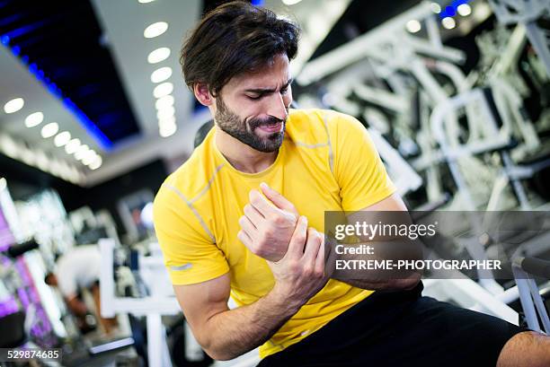 wrist injury during workout routine - wrist stock pictures, royalty-free photos & images