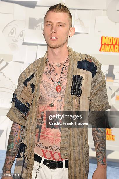 Musician Machine Gun Kelly arrives at the MTV Movie Awards held at the Nokia Theater, L.A. Live.