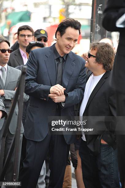 Actors John Cusack and Jack Black pose at Star ceremony honoring John Cusack on the Hollywood Walk of Fame.