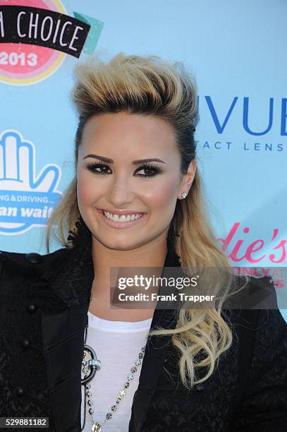 Singer Demi Lovato arrives at the Teen Choice Awards 2013 held at Universal Studios, Gibson Amphitheatre.