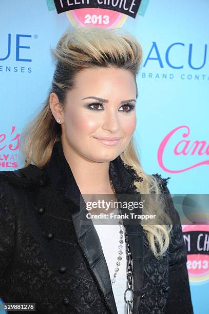Singer Demi Lovato arrives at the Teen Choice Awards 2013 held at Universal Studios, Gibson Amphitheatre.