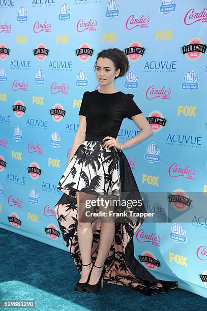 Actress Lilly Collins arrives at the Teen Choice Awards 2013 held at Universal Studios, Gibson Amphitheatre.