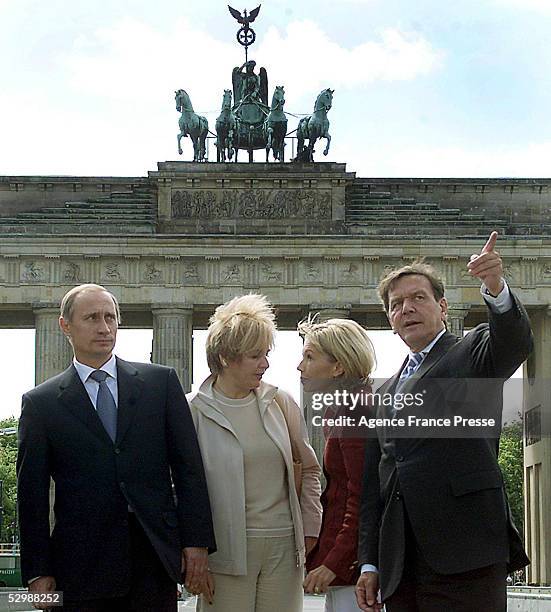 German Chancellor Gerhard Schroeder shows Russian President Vladimir Putin the distinctive sites of the Brandenburg Gate area, Berlin, June 16, 2000....