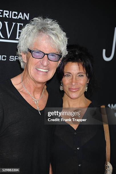 Musician Kevin Cronin and wife Lisa arrive at the premiere of Jobs held at Regal Cinemas L.A. Live.