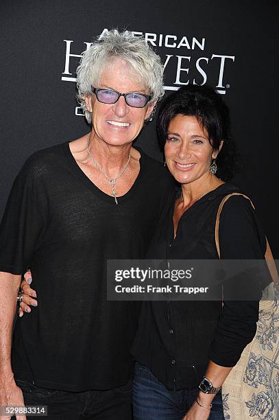 Musician Kevin Cronin and wife Lisa arrive at the premiere of Jobs held at Regal Cinemas L.A. Live.