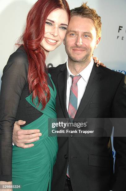 Actress Chloe Dykstra and comedian Chris Hardwick arrive at the premiere of The World's End held at the Cinerama Dome, Hollywood.